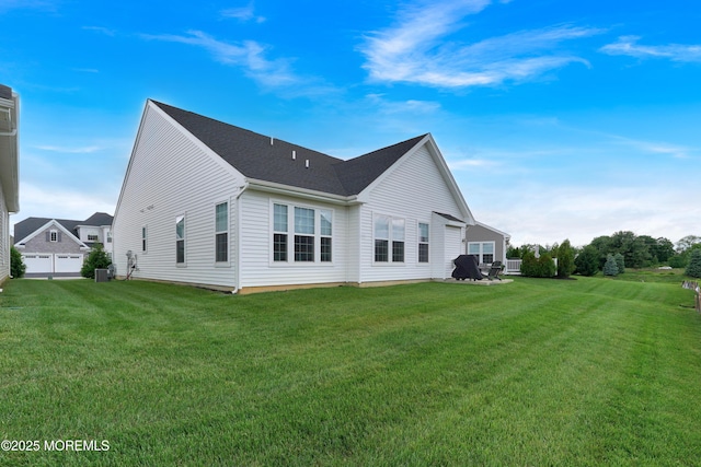 69 Starlight Dr, Monroe, NJ 08831 - rear view of property featuring a lawn and central air condition unit