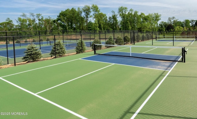 69 Starlight Dr, Monroe, NJ 08831 - view of tennis court with community basketball court and view of wooded area