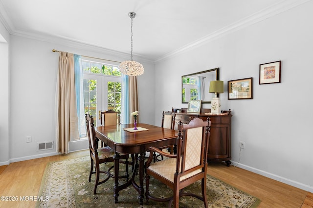 2060 Benjamin Cir, Wall, NJ 07719 - dining room featuring light wood-style flooring, crown molding, baseboards, and a chandelier