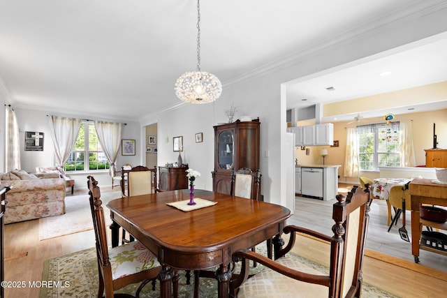 2060 Benjamin Cir, Wall, NJ 07719 - dining room featuring plenty of natural light, light wood-style flooring, ornamental molding, and a chandelier