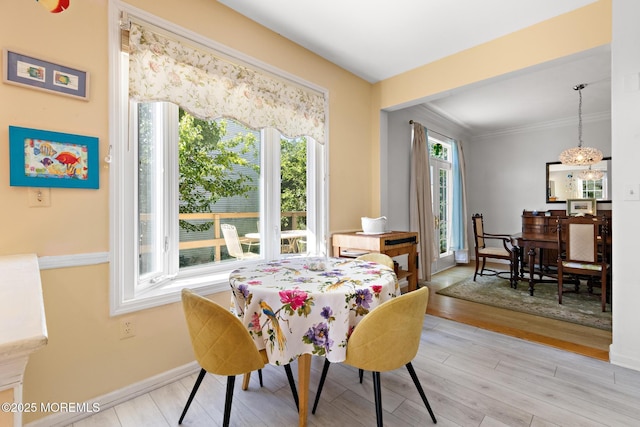 2060 Benjamin Cir, Wall, NJ 07719 - dining area with light wood-style flooring, baseboards, a chandelier, and crown molding