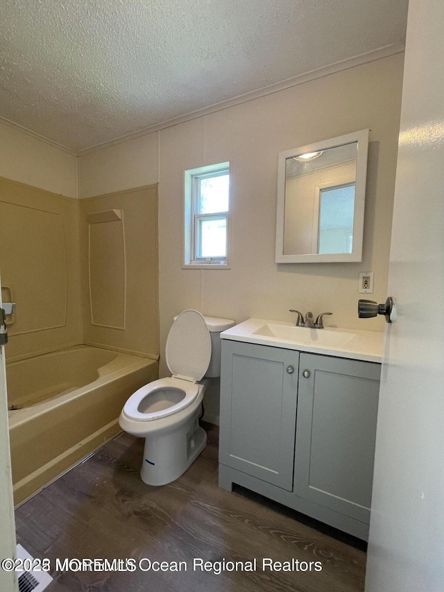 21 Citation St, Howell, NJ 07731 - full bath with vanity, toilet, wood finished floors, a textured ceiling, and crown molding