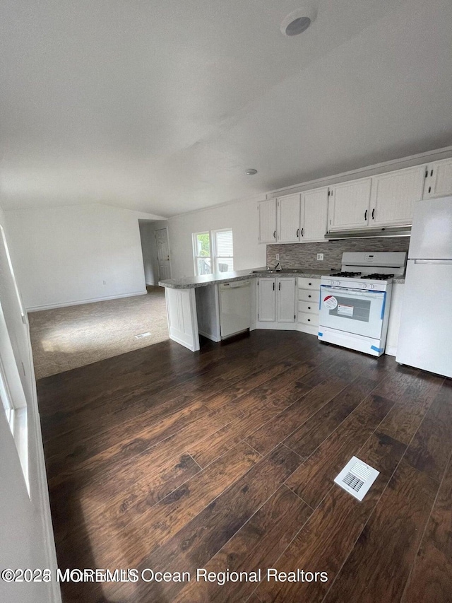 21 Citation St, Howell, NJ 07731 - kitchen featuring white appliances, a peninsula, dark wood-style flooring, white cabinetry, and a sink