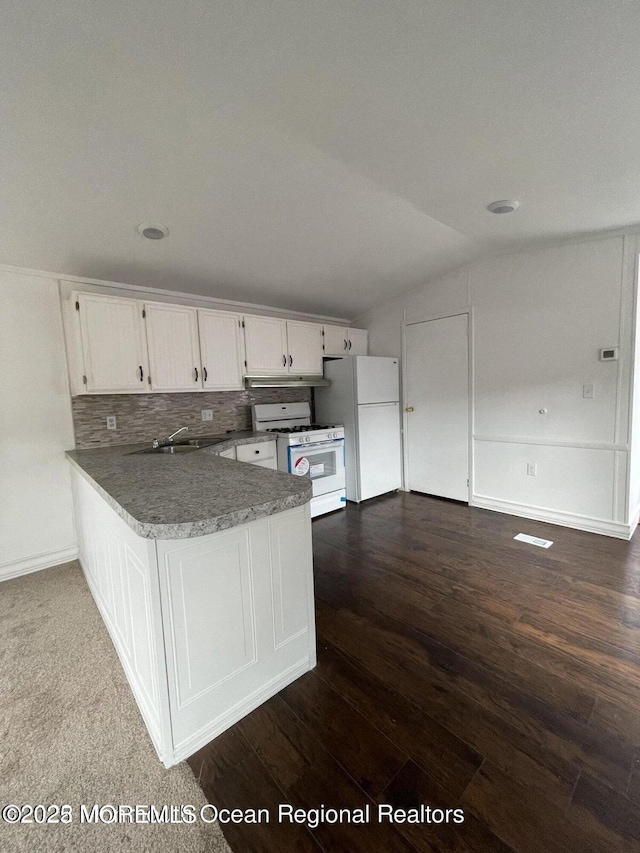21 Citation St, Howell, NJ 07731 - kitchen featuring white appliances, white cabinetry, a peninsula, a sink, and under cabinet range hood