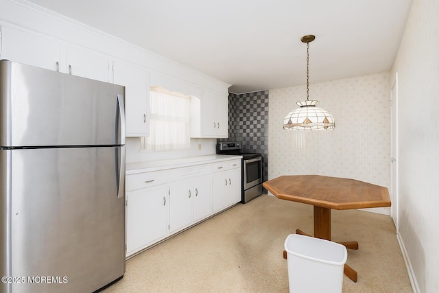 644 Monmouth Ave, Kenilworth, NJ 07033 - kitchen with stainless steel appliances, white cabinets, light countertops, light carpet, and wallpapered walls