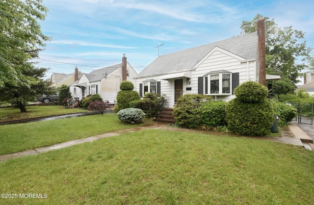 644 Monmouth Ave, Kenilworth, NJ 07033 - bungalow-style house featuring a chimney and a front lawn