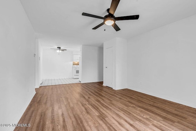 1320 State Route 71 Unit 202, Belmar, NJ 07719 - unfurnished living room with a ceiling fan, wood finished floors, and baseboards