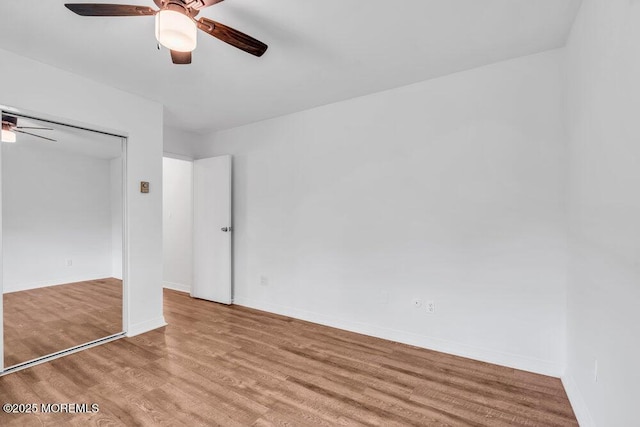 1320 State Route 71 Unit 202, Belmar, NJ 07719 - unfurnished bedroom with light wood finished floors, ceiling fan, and baseboards