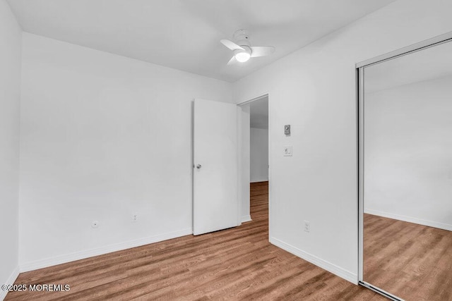 1320 State Route 71 Unit 202, Belmar, NJ 07719 - unfurnished bedroom with wood finished floors, a closet, baseboards, and a ceiling fan
