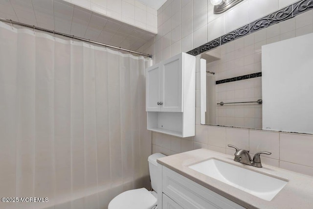1320 State Route 71 Unit 202, Belmar, NJ 07719 - full bathroom featuring tile walls, tasteful backsplash, vanity, toilet, and shower / bath combination with curtain
