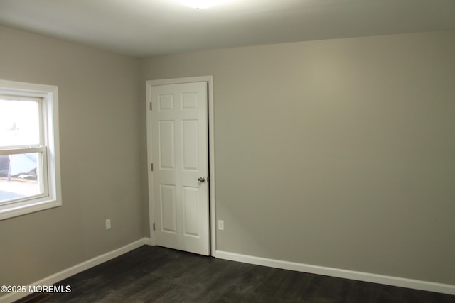 519 Roosevelt Ave, Carteret, NJ 07008 - spare room featuring baseboards and dark wood-style floors