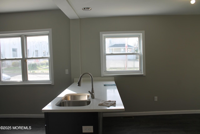 519 Roosevelt Ave, Carteret, NJ 07008 - kitchen with a sink, baseboards, healthy amount of natural light, and light countertops