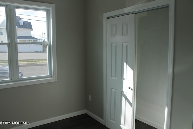 519 Roosevelt Ave, Carteret, NJ 07008 - unfurnished room with baseboards and dark wood-type flooring