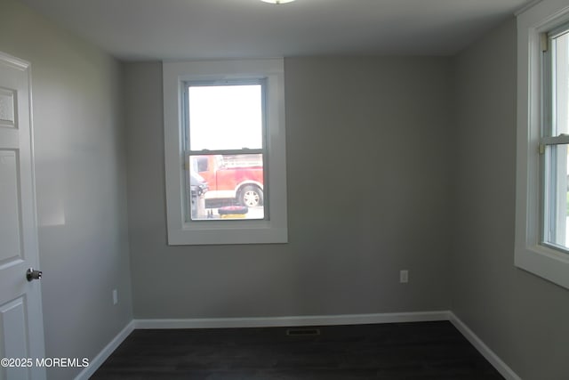 519 Roosevelt Ave, Carteret, NJ 07008 - unfurnished room with plenty of natural light, baseboards, and dark wood-style flooring