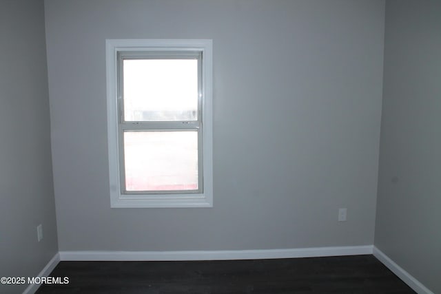 519 Roosevelt Ave, Carteret, NJ 07008 - spare room with baseboards and dark wood-type flooring