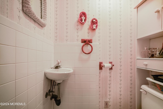 18 Lillie Rd, Toms River, NJ 08753 - bathroom featuring tile walls, toilet, wallpapered walls, and a wainscoted wall