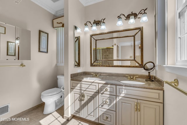25 Bellflower Dr, Lakewood, NJ 08701 - bathroom featuring toilet, double vanity, crown molding, tile patterned flooring, and baseboards