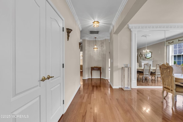 25 Bellflower Dr, Lakewood, NJ 08701 - hall featuring hardwood / wood-style floors, ornamental molding, baseboards, and a chandelier