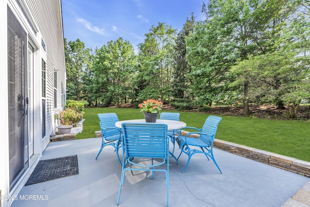25 Bellflower Dr, Lakewood, NJ 08701 - view of patio / terrace with outdoor dining area and view of wooded area