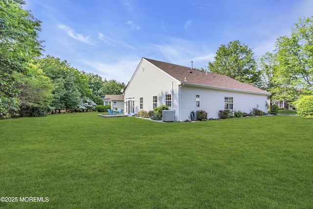 25 Bellflower Dr, Lakewood, NJ 08701 - view of home's exterior featuring a lawn and central AC