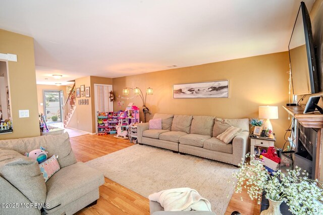 25 Atlantis Ter, Freehold, NJ 07728 - living room featuring wood finished floors and stairs