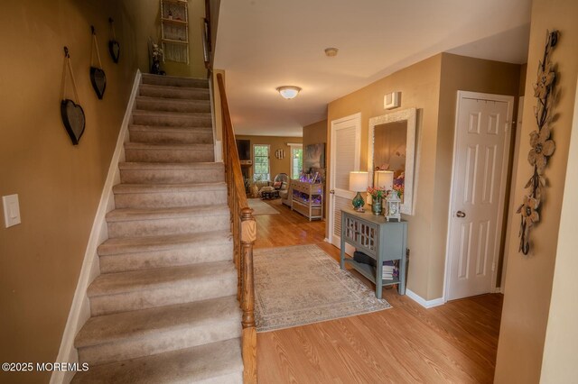 25 Atlantis Ter, Freehold, NJ 07728 - stairway with wood finished floors and baseboards