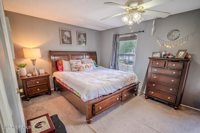 25 Atlantis Ter, Freehold, NJ 07728 - bedroom featuring light carpet, a ceiling fan, a textured ceiling, and baseboards