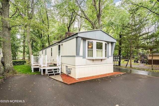 39 Marcia Memorial Cir, Jackson, NJ 08527 - view of front of home featuring a wooden deck and view of wooded area