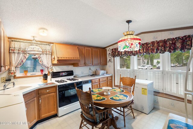 39 Marcia Memorial Cir, Jackson, NJ 08527 - kitchen with range with gas stovetop, light floors, a sink, a textured ceiling, and premium range hood