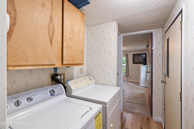 39 Marcia Memorial Cir, Jackson, NJ 08527 - laundry room with cabinet space, light wood-type flooring, washing machine and clothes dryer, wallpapered walls, and a textured ceiling