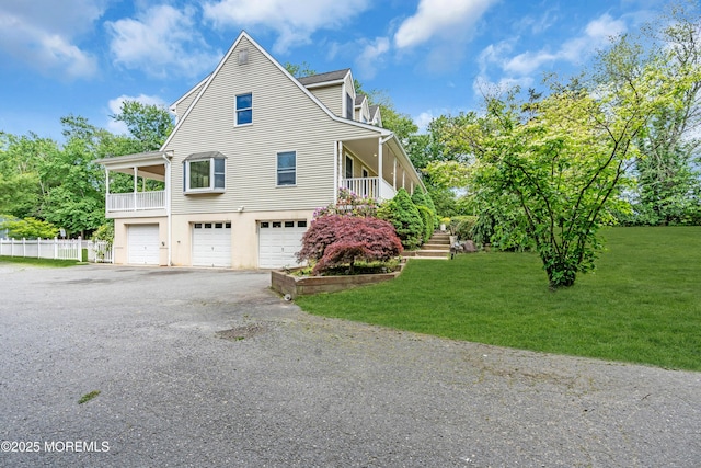 668 Hyson Rd, Jackson, NJ 08527 - view of home's exterior featuring an attached garage, a lawn, asphalt driveway, and stairs