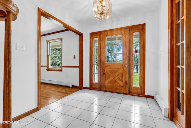 668 Hyson Rd, Jackson, NJ 08527 - foyer entrance featuring a baseboard radiator, light tile patterned flooring, baseboards, and a chandelier