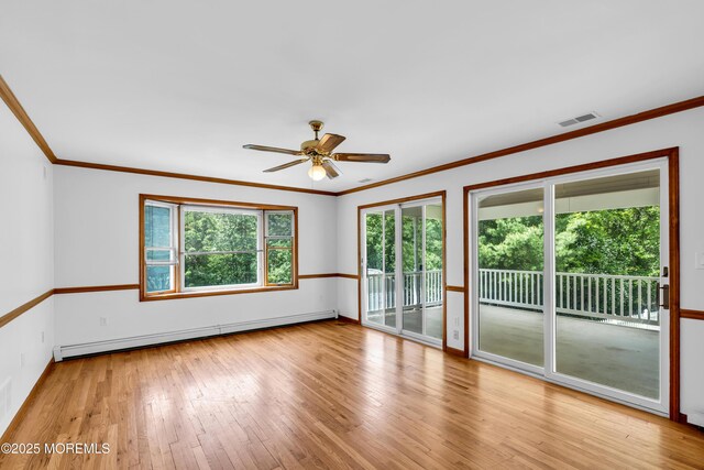 668 Hyson Rd, Jackson, NJ 08527 - spare room featuring baseboard heating, wood-type flooring, ceiling fan, crown molding, and baseboards