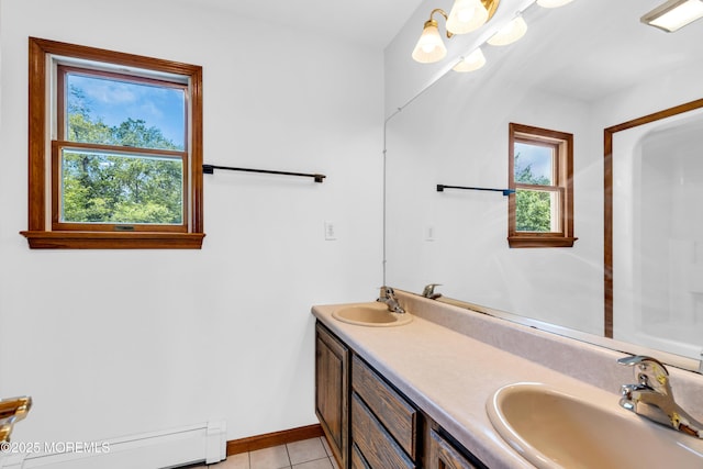 668 Hyson Rd, Jackson, NJ 08527 - full bathroom with baseboard heating, double vanity, tile patterned floors, and baseboards