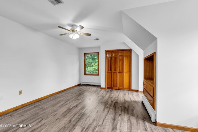 668 Hyson Rd, Jackson, NJ 08527 - unfurnished bedroom with a baseboard heating unit, wood finished floors, baseboards, and baseboard heating