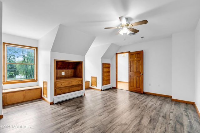 668 Hyson Rd, Jackson, NJ 08527 - additional living space with a baseboard radiator, wood finished floors, a ceiling fan, and baseboards