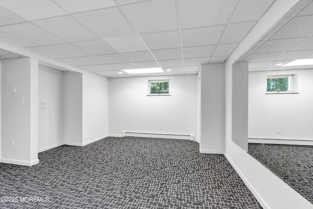 668 Hyson Rd, Jackson, NJ 08527 - basement featuring a baseboard heating unit, a paneled ceiling, plenty of natural light, and baseboards