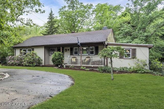 24 Delaware Trl, Browns Mills, NJ 08015 - ranch-style house with covered porch, a front lawn, and driveway