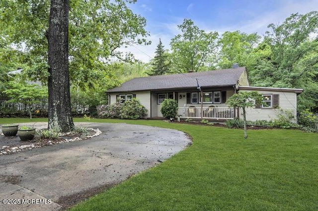 24 Delaware Trl, Browns Mills, NJ 08015 - ranch-style home featuring covered porch, curved driveway, and a front yard