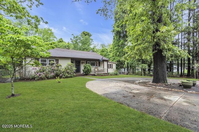 24 Delaware Trl, Browns Mills, NJ 08015 - view of front facade with a front yard and covered porch