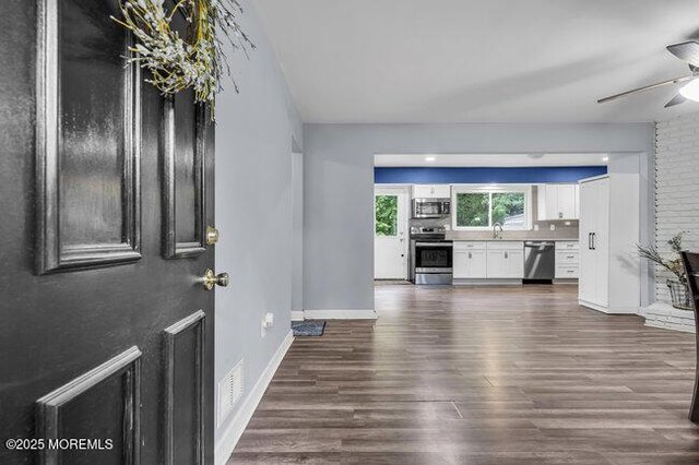 24 Delaware Trl, Browns Mills, NJ 08015 - entryway with ceiling fan, dark wood-type flooring, and baseboards
