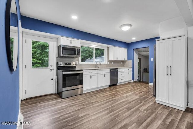 24 Delaware Trl, Browns Mills, NJ 08015 - kitchen featuring stainless steel appliances, white cabinetry, light countertops, and recessed lighting