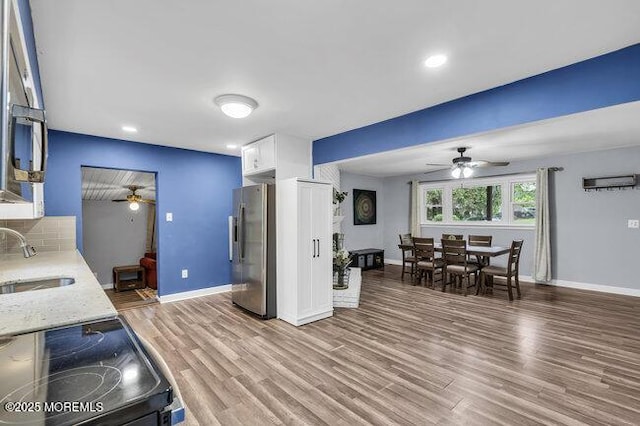 24 Delaware Trl, Browns Mills, NJ 08015 - kitchen featuring stainless steel fridge with ice dispenser, a ceiling fan, a sink, light wood-type flooring, and recessed lighting