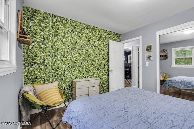24 Delaware Trl, Browns Mills, NJ 08015 - bedroom with wallpapered walls, wood finished floors, and an accent wall