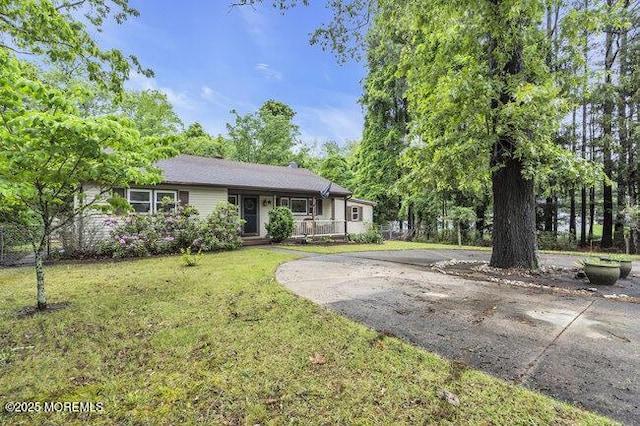 24 Delaware Trl, Browns Mills, NJ 08015 - single story home featuring a front yard, driveway, and a porch