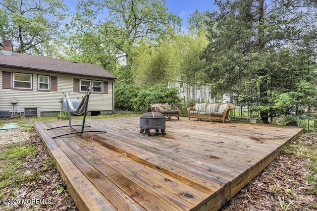 24 Delaware Trl, Browns Mills, NJ 08015 - wooden deck with a fire pit