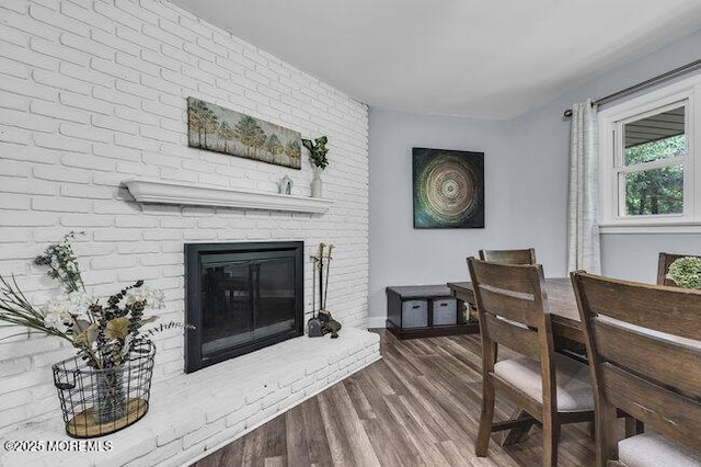 24 Delaware Trl, Browns Mills, NJ 08015 - dining room featuring a brick fireplace, wood finished floors, and baseboards