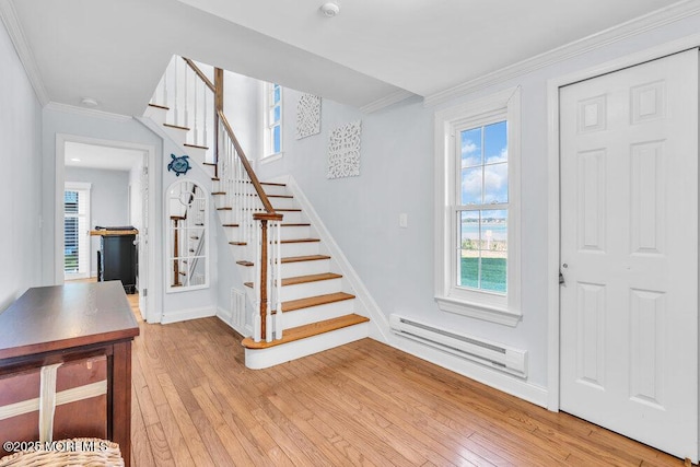 332 Seaview Cir, Neptune Township, NJ 07753 - entryway with light wood finished floors, stairway, a baseboard radiator, healthy amount of natural light, and crown molding