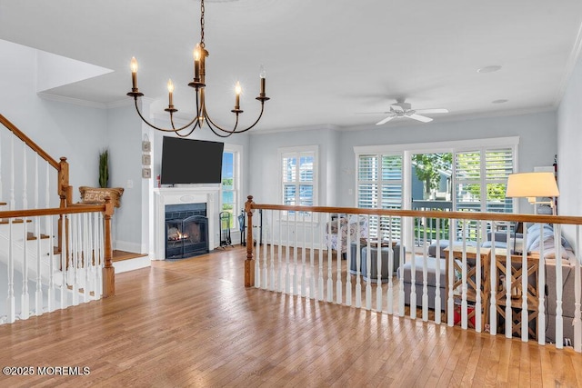 332 Seaview Cir, Neptune Township, NJ 07753 - living area with wood finished floors, crown molding, a ceiling fan, and a fireplace with flush hearth