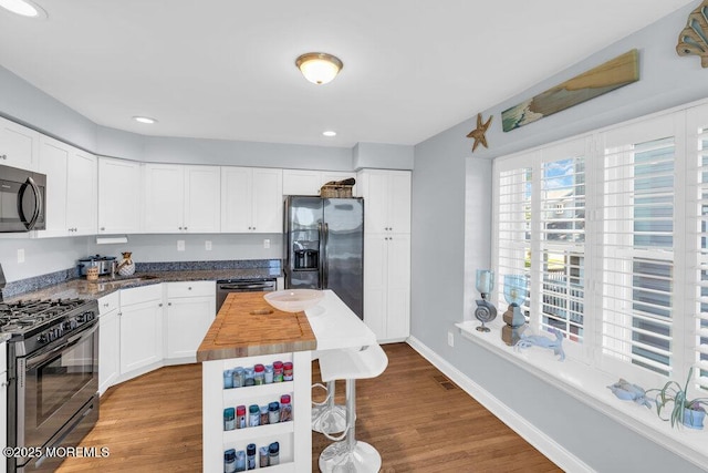 332 Seaview Cir, Neptune Township, NJ 07753 - kitchen featuring range with gas cooktop, fridge with ice dispenser, wooden counters, wood finished floors, and dishwasher